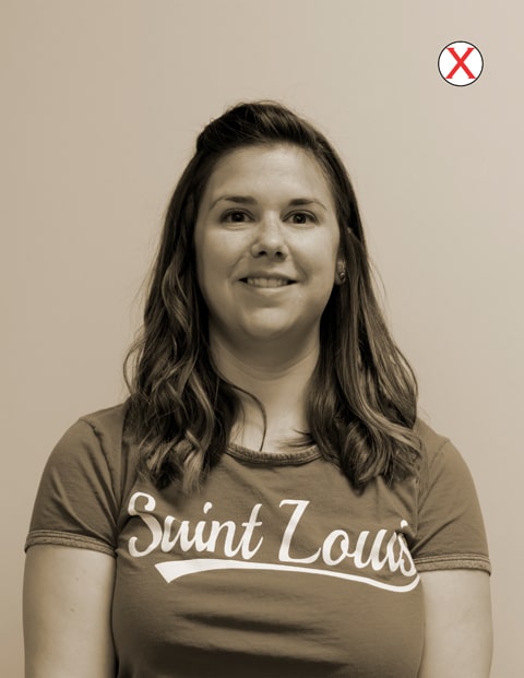 A headshot of a woman wearing a SLU t-shirt. The color of the image has been changed to a sepia tone.