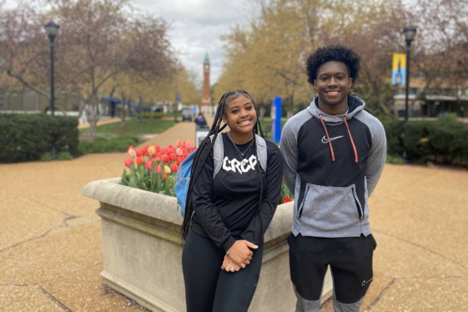 Sabrina Brown and Carson Boyd Two high school students pose for a photo on West Pine Mall, with the clock tower in the background.