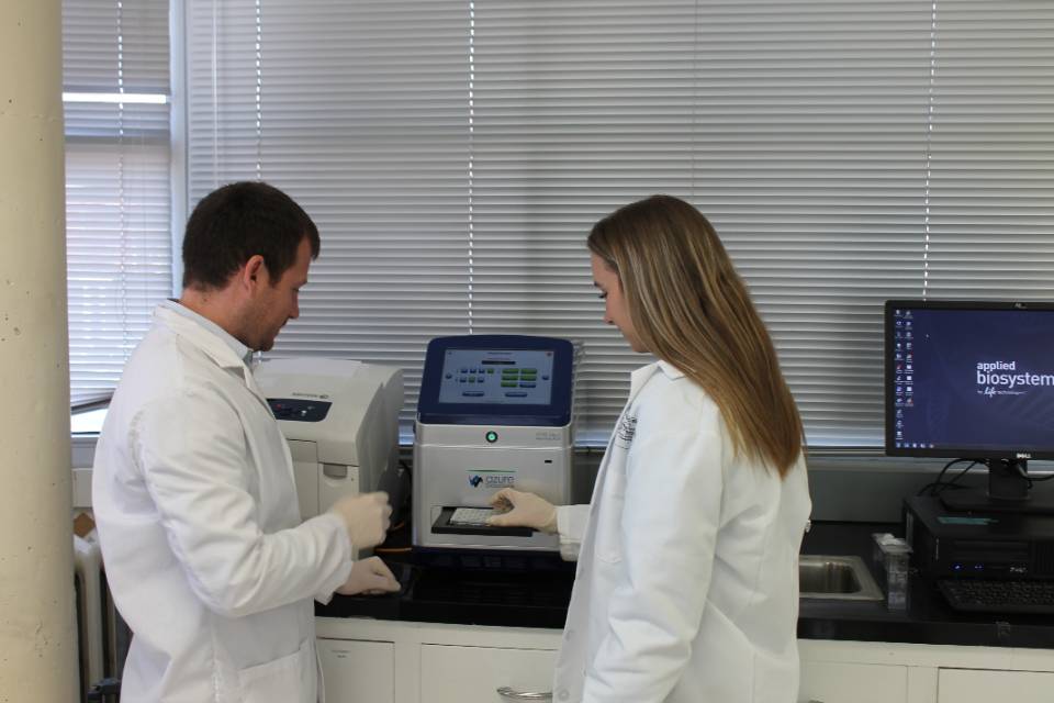 forensic science lab with student and professor forensic science lab with student and professor