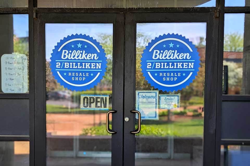 The doors of the Billiken 2 Billiken resale shop. The doors have signs that read "Billiken 2 Billiken"