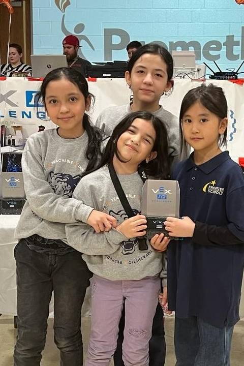 Frontier Schools teamwork championship award in Kirkwood Four students pose with an awards plaque