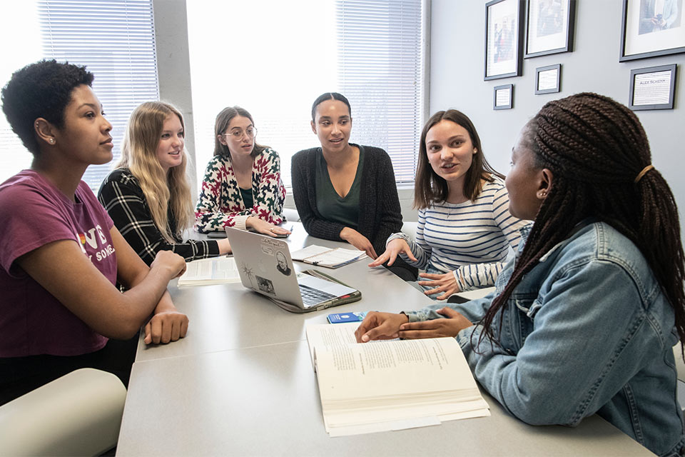 Group of students around a table.