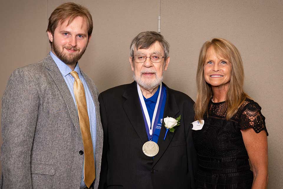 Frank Magiera, Ph.D. (PC ’62) poses with his family