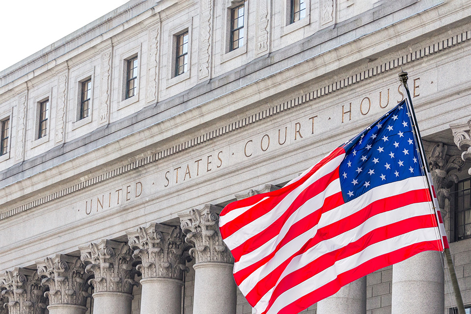An American flag hangs outside the United States Supreme Courthouse Supreme Court Building