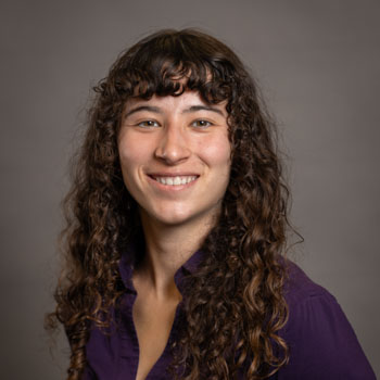 Abby Van Vooren smiling in a professional headshot.