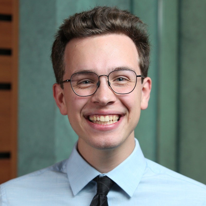 Michael Poirier smiling in a professional headshot.