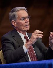 Dr. Alderson Retirement Picture Dr. Alderson sitting and presenting at the Bander Center