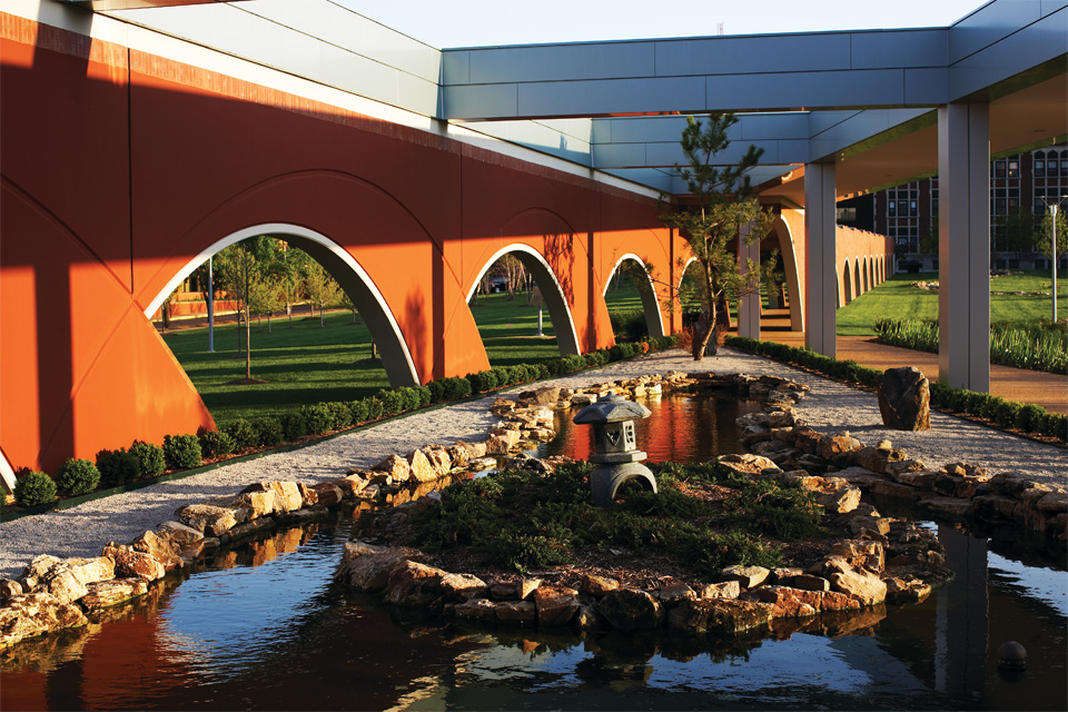 Photo shows the outside of the arched walkway heading from Doisy Hall looking at a Garden. Photo shows the outside of the arched walkway heading from Doisy Hall looking at a Garden.