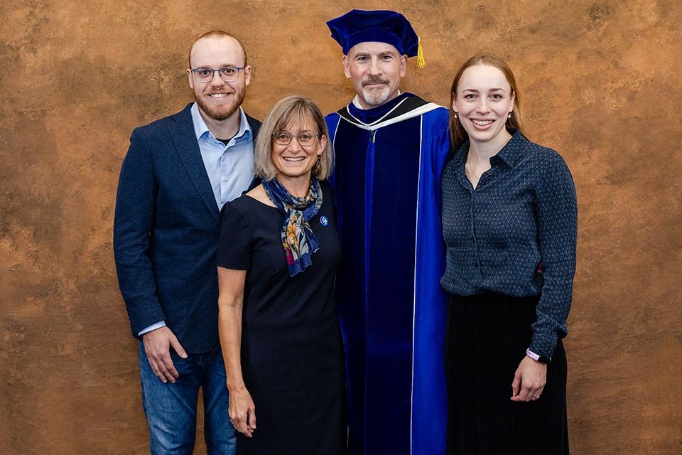 Feser family at inauguration A formal photo of the Feser family, including SLU President Ed Feser in academic regalia, his wife, son and daughter